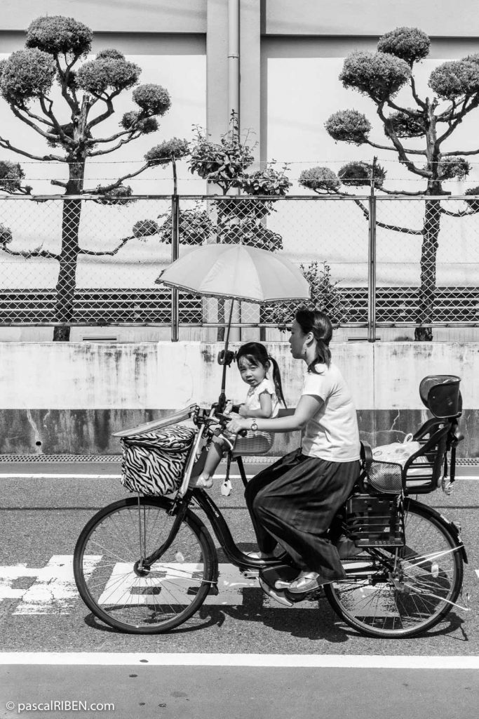 Mother and daughter on Bicycle, in Daitō, Osaka prefecture, Japan