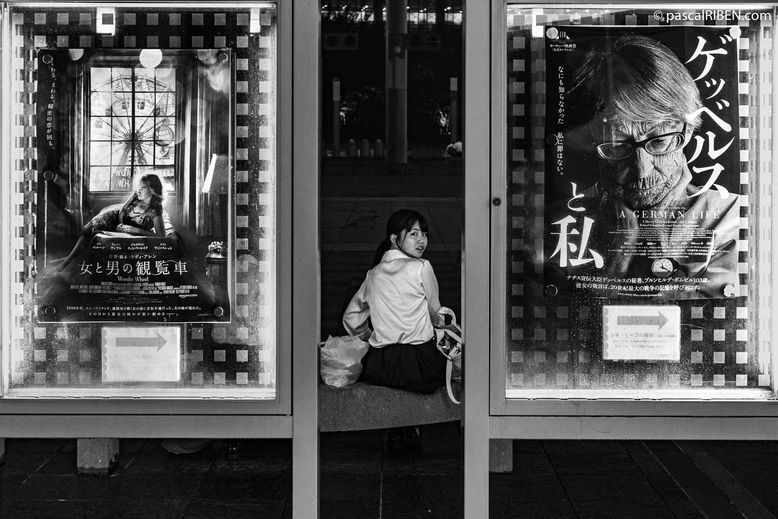 Two posters and a young Japanese woman from the cinema inside the Umeda Sky Builing: "A German Life" and on the left, Woody Allen's "Wonder Wheel" movie.