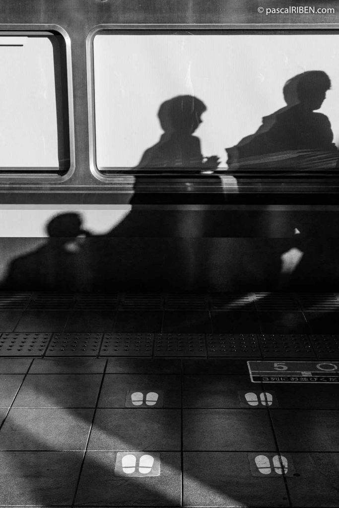 Shadows on the car and marking at Osaka Station.