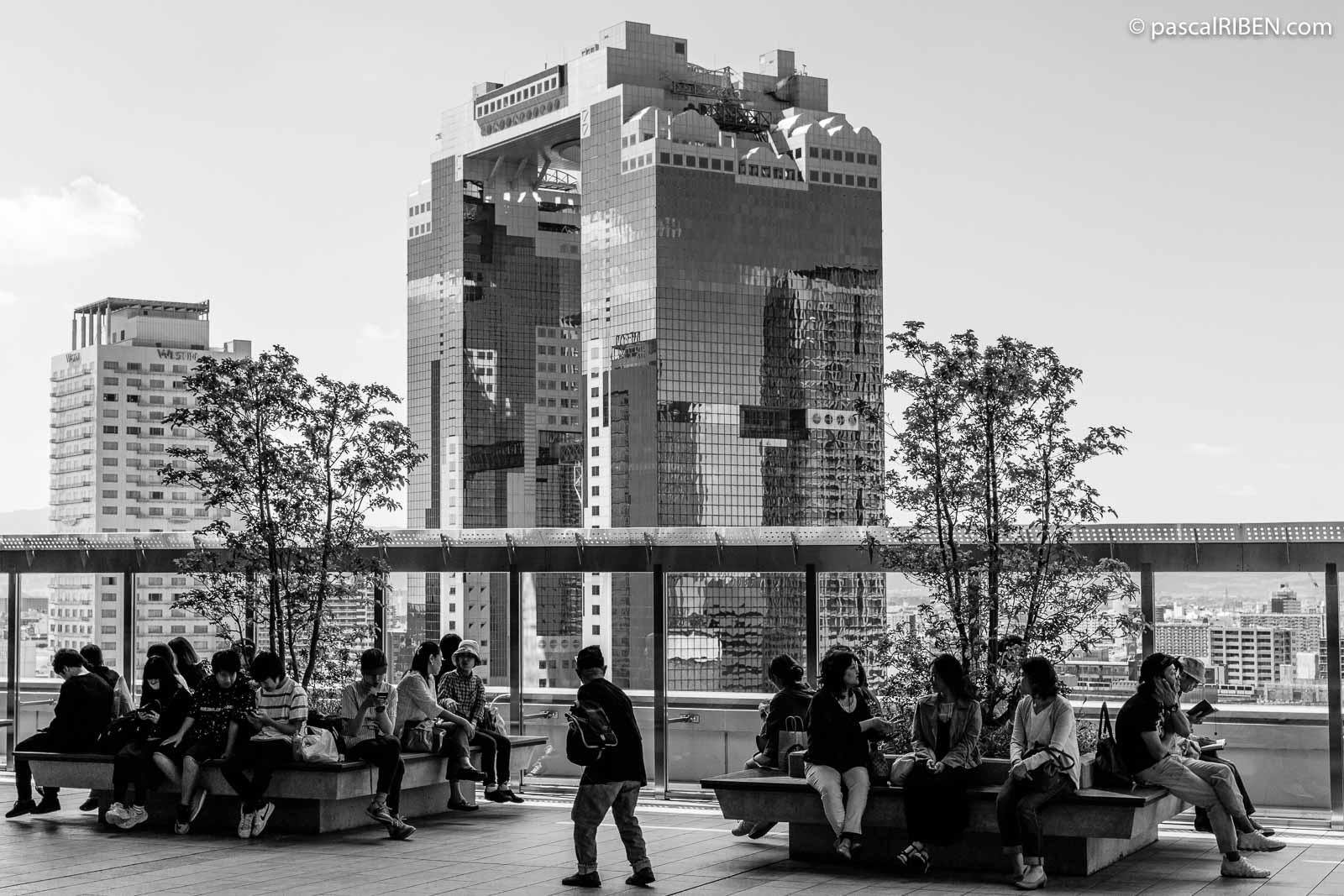 View of the Umeda Sky Building from the Osaka Railway Station rooftop.